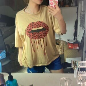 OVERSIZED cute lip shirt!! Personally I love but Tan does not look good on me :(